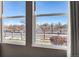 View of the neighborhood with trees and a fence from the window at 17359 Waterhouse Cir # C, Parker, CO 80134