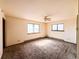 Expansive bedroom with neutral walls, two windows and ceiling fan at 1151 Castlewood Pl, Franktown, CO 80116