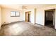 Spacious bedroom featuring a ceiling fan, closet, and a window that brings in natural light at 1151 Castlewood Pl, Franktown, CO 80116
