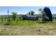 Home exterior with greenery and clear blue sky at 1151 Castlewood Pl, Franktown, CO 80116