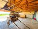 Large garage with wooden beams and horse carriage at 1151 Castlewood Pl, Franktown, CO 80116