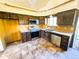This kitchen has stainless steel appliances and warm, neutral cabinets at 1151 Castlewood Pl, Franktown, CO 80116