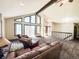Inviting living room with neutral colors, vaulted ceiling, and lots of light at 1151 Castlewood Pl, Franktown, CO 80116