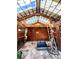 Shed with exposed rafters, ladder and door at 1151 Castlewood Pl, Franktown, CO 80116