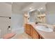 Cozy bathroom featuring a shower-tub combo, a single vanity, and a decorative pink theme at 153 Gold Run Trl, Idaho Springs, CO 80452