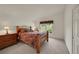 Carpeted bedroom with window view, offering natural light and scenic views of the surrounding area at 153 Gold Run Trl, Idaho Springs, CO 80452