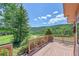 Wooden deck with scenic mountain views and large evergreen tree at 153 Gold Run Trl, Idaho Springs, CO 80452