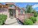 Charming home featuring a welcoming front porch, complemented by mature landscaping, creating a cozy curb appeal at 153 Gold Run Trl, Idaho Springs, CO 80452