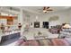 Open-concept living room with a fireplace and bar adjacent to the kitchen at 153 Gold Run Trl, Idaho Springs, CO 80452