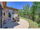 Outdoor patio area perfect for dining and relaxing with wooded views at 153 Gold Run Trl, Idaho Springs, CO 80452