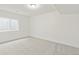 Bright bedroom features neutral carpet, white walls, and a window for natural light at 20590 E 58Th Ave, Aurora, CO 80019
