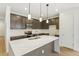 Beautiful kitchen with quartz countertop island, stainless steel appliances, and pendant lighting at 20590 E 58Th Ave, Aurora, CO 80019