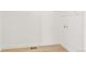 This laundry room features a white wall, wood-look flooring, and a wire shelf at 20590 E 58Th Ave, Aurora, CO 80019