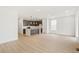 Bright and airy living room with an open kitchen featuring a center island at 20590 E 58Th Ave, Aurora, CO 80019