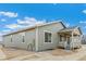 The home's rear exterior features a covered porch and neutral siding at 20590 E 58Th Ave, Aurora, CO 80019