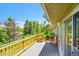A spacious outdoor deck offers a perfect place to relax with serene views of the surrounding greenery at 7448 W Geddes Pl, Littleton, CO 80128