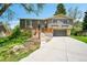 Charming split-level home featuring a newly built deck and attached two-car garage at 7448 W Geddes Pl, Littleton, CO 80128
