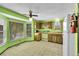 A bright kitchen featuring original cabinetry, appliances, and a spacious dining area at 7448 W Geddes Pl, Littleton, CO 80128