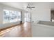 Bright living room with hardwood floors, large windows, and white walls at 35 S Cody St, Lakewood, CO 80226