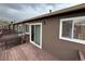 View of the outdoor back deck with sliding glass doors at 6921 S Bryant St, Littleton, CO 80120