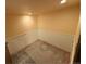 Spacious basement room featuring wainscoting and neutral walls, ready for customization at 6921 S Bryant St, Littleton, CO 80120