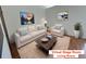 Bright living room with large windows and comfortable seating at 6921 S Bryant St, Littleton, CO 80120