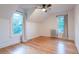 Bright bedroom featuring hardwood floors, neutral walls, and two large windows with natural light at 2445 W 39Th Ave, Denver, CO 80211