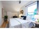 Bedroom with window, hardwood floors, a ceiling fan, and neutral decor at 2445 W 39Th Ave, Denver, CO 80211