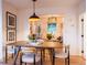 Elegant dining room with modern furnishings and an open view into the adjacent living room at 2445 W 39Th Ave, Denver, CO 80211