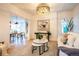 Cozy living room featuring modern decor, hardwood floors, and a glimpse into the dining area at 2445 W 39Th Ave, Denver, CO 80211