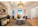 Bright living room with hardwood floors, white sofa, modern lighting, and stylish decor at 2445 W 39Th Ave, Denver, CO 80211