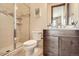 Bathroom featuring shower, granite vanity, and wood trimmed mirror at 9435 Winding Hill Way, Lone Tree, CO 80124