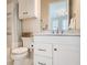 Bathroom with a white vanity, marble countertop, and a shower/tub combo at 9435 Winding Hill Way, Lone Tree, CO 80124