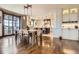 Lovely dining room featuring hardwood floors that lead into the gourmet kitchen at 9435 Winding Hill Way, Lone Tree, CO 80124