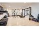 Well-equipped home gym featuring modern exercise equipment and natural light at 9435 Winding Hill Way, Lone Tree, CO 80124