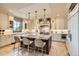 Beautiful kitchen with a large island, pendant lights, and modern appliances at 9435 Winding Hill Way, Lone Tree, CO 80124