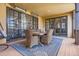 Inviting patio features a dining set, heaters, and sliding doors for seamless indoor/outdoor living at 9435 Winding Hill Way, Lone Tree, CO 80124