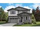 Charming two-story home featuring craftsman-style architecture with a covered porch and professionally landscaped yard at 8259 Rockvale Dr, Littleton, CO 80125