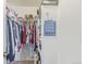 Well-organized closet with hanging rods and shelving at 12077 Ivy Ct, Brighton, CO 80602