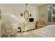 Bright and airy bedroom with elegant dresser and mirror, offering a tranquil retreat at 300 Hudson St # 202, Denver, CO 80220