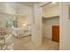 Cozy bedroom with walk-in closet, neutral walls, and plantation shutters at 300 Hudson St # 202, Denver, CO 80220