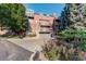 Brick condos feature garages and greenery in a suburban location at 300 Hudson St # 202, Denver, CO 80220