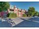 Brick exterior with balconies, parking and lush green trees surrounding at 300 Hudson St # 202, Denver, CO 80220