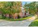 Charming brick townhome with a well maintained lawn and walkway at 300 Hudson St # 202, Denver, CO 80220