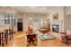 Bright living room featuring hardwood floors, fireplace, and comfortable seating at 300 Hudson St # 202, Denver, CO 80220