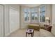 Sitting room with three bright windows, plantation shutters, and a large closet at 300 Hudson St # 202, Denver, CO 80220