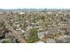 Expansive aerial view of a residential neighborhood with mature trees and city skyline in the background at 1486 S Elm St, Denver, CO 80222