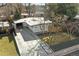 Aerial view of a modern single-Gathering home with a long driveway and landscaped front yard at 1486 S Elm St, Denver, CO 80222