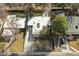 Aerial view of the property featuring a well-maintained lawn and modern hardscape patio at 1486 S Elm St, Denver, CO 80222