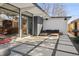 Beautiful outdoor patio with geometric concrete pavers, comfortable seating, and modern architectural details at 1486 S Elm St, Denver, CO 80222